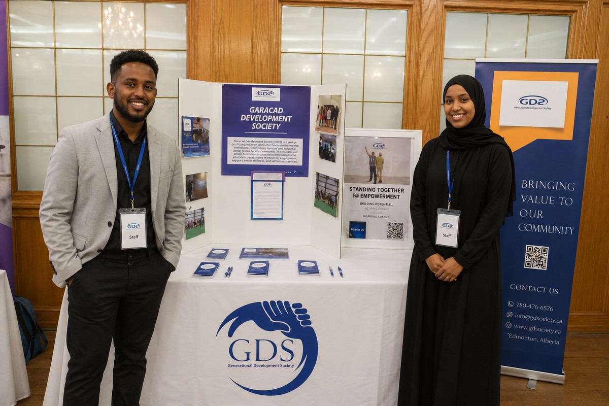 GDS staff at a community outreach booth showcasing programs
